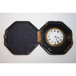 AN ANTIQUE LEATHER FITTED CASED TRAVEL WATCH