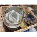 A WICKER BASKET OF ASSORTED CHINA TO INCLUDE AN ADDERLY GILT CUP AND SAUCER ETC.