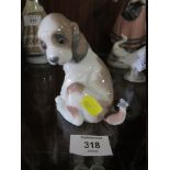 A LLADRO FIGURE OF A PUPPY WITH A BUTTERFLY ON ITS TAIL