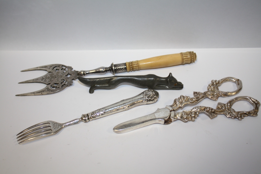 A WILLIAM IV SILVER FORK, TOGETHER WITH A FOX SHAPED KNIFE REST ETC. (4)
