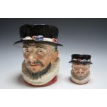 TWO GRADUATING ROYAL DOULTON CHARACTER JUGS - BEEFEATER, consisting of medium D6233 and large, H 19