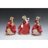 THREE ROYAL DOULTON FIGURES CONSISTING OF TWO TOP O' THE HILL HN1834, and Autumn Breezes HN1934