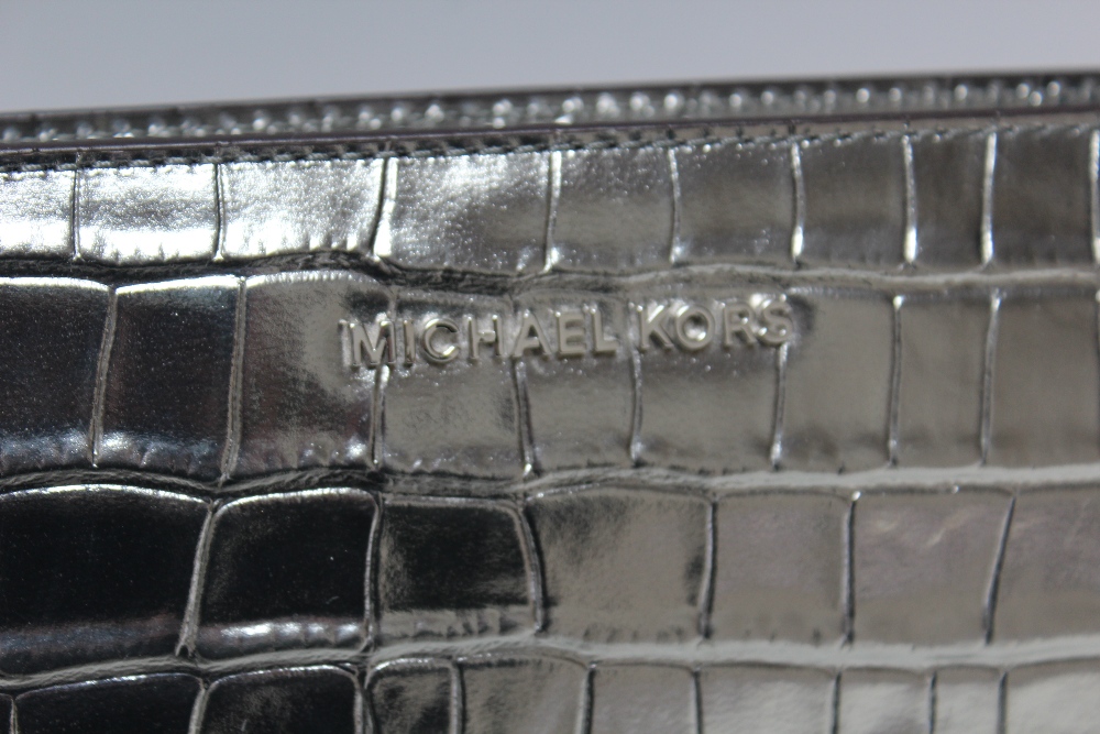 A MICHAEL KORS GUNMETAL EMBOSSED LEATHER CROSS BODY CLUTCH BAG, single open pocket to reverse of bag - Image 2 of 4