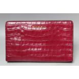 A MICHAEL KORS FUSHIA EMBOSSED LEATHER CROSS BODY CLUTCH BAG, single open pocket to reverse of bag