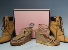 A BOXED PAIR OF JUICY COUTURE 'DAINTY' BEIGE LATHER WEDGE SANDALS, US size 8 1/2. together with a