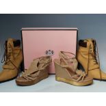 A BOXED PAIR OF JUICY COUTURE 'DAINTY' BEIGE LATHER WEDGE SANDALS, US size 8 1/2. together with a