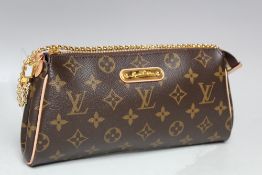 A SMALL LOUIS VUITTON MONOGRAM POCHETTE STYLE SHOULDER BAG, with metal chain link handle and