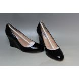 A PAIR OF L.K. BENNETT ESMERALDA PATENT BLACK WEDGE SHOES, size EU 36