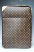 A LOUIS VUITTON MONOGRAM PEGASE LEGERE SUITCASE, with leather strap handles, adjustable pull handle,