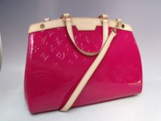 A LOUIS VUITTON INDIAN ROSE MONOGRAM VERNIS BREA MM BAG, double flat leather handles, and