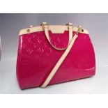 A LOUIS VUITTON INDIAN ROSE MONOGRAM VERNIS BREA MM BAG, double flat leather handles, and