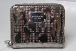 A MICHAEL KORS SMALL WALLET / COIN PURSE, metallic finish with initials logo, note compartment,