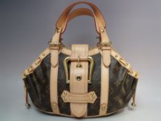 A LOUIS VUITTON THEDA GM MONOGRAM HANDBAG, dual leather handles and buckle belt closure, dust bag, H