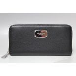 A MICHAEL KORS BLACK LEATHER LADIES WALLET, subtle textured effect finish, note compartments, zip