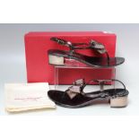 A BOXED PAIR OF SALVATORE FERRAGAMO BLOCK HEEL SANDALS. in black, metallic and opaque PVC, US size