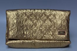 A LOUIS VUITTON QUILTED POUCH GOLD LIMELIGHT CLUTCH BAG, with Louis Vuitton badge to the front, with