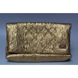 A LOUIS VUITTON QUILTED POUCH GOLD LIMELIGHT CLUTCH BAG, with Louis Vuitton badge to the front, with