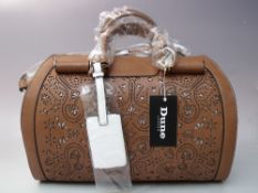A DUNE OF LONDON BARREL BAG, in tan and white leather with a cut out design, twin handles and