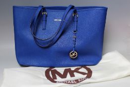 A MICHAEL KORS SAFFIANO LEATHER LARGE TOTE BAG IN SAPPHIRE BLUE, open top with grey logo fabric