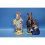 A ROYAL DOULTON BUNNYKINS 'FAMILY PHOTOGRAPH' TOGETHER WITH A BESWICK 'PETER RABBIT GARDENING' (2)