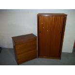 A TWO PIECE BEDROOM SUITE WITH SLIDING DOORS CONSISTING OF A WARDROBE AND A FIVE DRAWER CHEST MADE