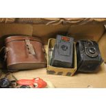 A SMALL TRAY TO INCLUDE A PAIR OF 'EAGLE EYE' BINOCULARS AND AN ENSIGN CADET CAMERA, A FULL VUE