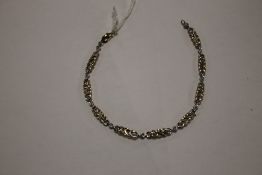 A 9 CT GOLD DIAMOND BRACELET