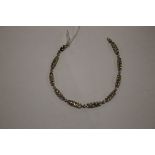 A 9 CT GOLD DIAMOND BRACELET