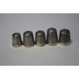 FIVE SILVER THIMBLES