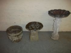 THREE CONCRETE GARDEN ORNAMENTS TO INCLUDE A GARDEN STATUE BIRD BATH, A MUSHROOM AND A PLANTER.