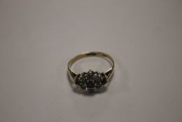 A LADIES 9 CT GOLD DRESS RING SET WITH CZS AND PURPLE STONES