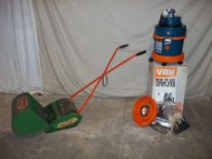 A SUFFOLK SUPER SWIFT PUSH LAWNMOWER AND AN UNUSED VAX CARPET CLEANER/HOOVER.