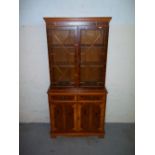 A YEW GLAZED BOOKSHELF DISPLAY CABINET.