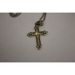 A CROSS ON A SILVER CHAIN