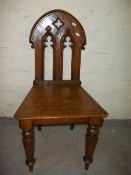 AN ANTIQUE OAK GOTHIC STYLE CHAIR