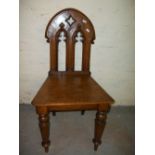 AN ANTIQUE OAK GOTHIC STYLE CHAIR