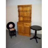 THREE ITEMS: A SOLID PINE DISPLAY WELSH DRESSER WALL UNIT AND TWO BLACK TABLES.