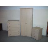 A MODERN THREE PIECE BEDROOM SUITE TO INCLUDE ONE WARDROBE, A FIVE DRAWER CHEST OF DRAWERS AND A