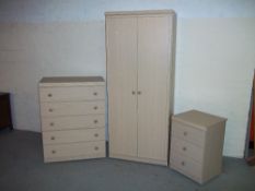 A MODERN THREE PIECE BEDROOM SUITE TO INCLUDE ONE WARDROBE, A FIVE DRAWER CHEST OF DRAWERS AND A