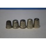 FIVE SILVER THIMBLES