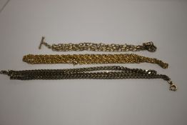 A 9 CT GOLD T BAR NECKLACE A/F W 3.4 g AND TWO OTHER COSTUME CHAINS