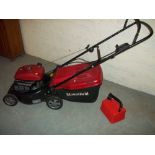 A MOUNTFIELD PETROL LAWNMOWER.