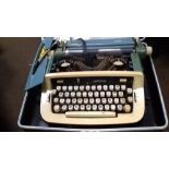 A CASED VINTAGE IMPERIAL TYPEWRITER