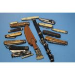 A COLLECTION OF POCKET KNIVES AND OTHERS TOGETHER WITH PART OF A WOODWIND INSTRUMENT