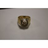 A HORSESHOE RING, POSSIBLY 18 CT YELLOW METAL