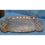A LARGE SILVER PLATED ART NOUVEAU TWIN HANDLED TRAY