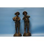 A PAIR OF COLD PAINTED FIGURES OF BOYS SIGNED KEFFLER, ONE PLAYING THE BAGPIPES, THE OTHER A HORN