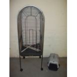 A LARGE PARROT CAGE AND A CAT CARRIER