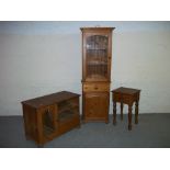 THREE ITEMS: SOLID PINE DISPLAY CABINET AND A MEDIA TV UNIT AND A SOLID PINE TABLE.
