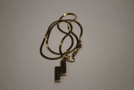 A YELLOW METAL PENDANT AND CHAIN (CHAIN MARKED 916 AND WEIGHS 4.9 g